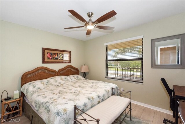 12581 Kelly Sands Way Unit 525, Fort Myers, FL 33908 - bedroom featuring light wood finished floors, baseboards, and a ceiling fan
