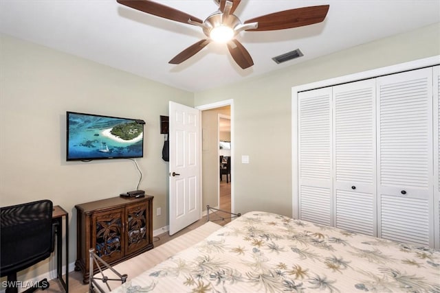 12581 Kelly Sands Way Unit 525, Fort Myers, FL 33908 - bedroom with a closet, wood finished floors, and ceiling fan