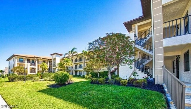 12581 Kelly Sands Way Unit 525, Fort Myers, FL 33908 - view of home's community with stairs and a yard