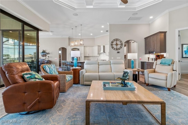 4324 SW 26th Ave, Cape Coral, FL 33914 - living area featuring arched walkways, ornamental molding, plenty of natural light, wood finished floors, and recessed lighting