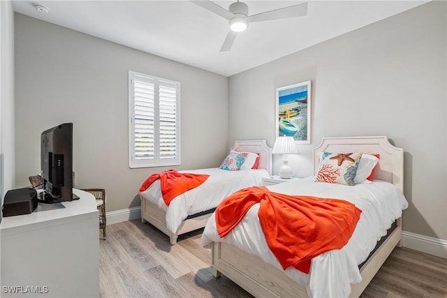 4324 SW 26th Ave, Cape Coral, FL 33914 - bedroom featuring light wood finished floors, baseboards, and ceiling fan