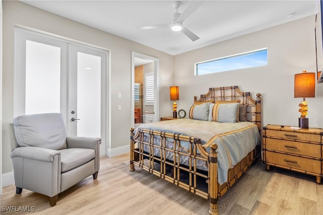 4324 SW 26th Ave, Cape Coral, FL 33914 - bedroom with light wood-style floors, baseboards, and ceiling fan