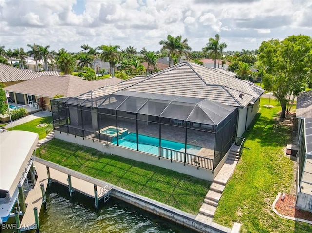 4324 SW 26th Ave, Cape Coral, FL 33914 - rear view of property featuring a pool with connected hot tub, a water view, a yard, and a patio area