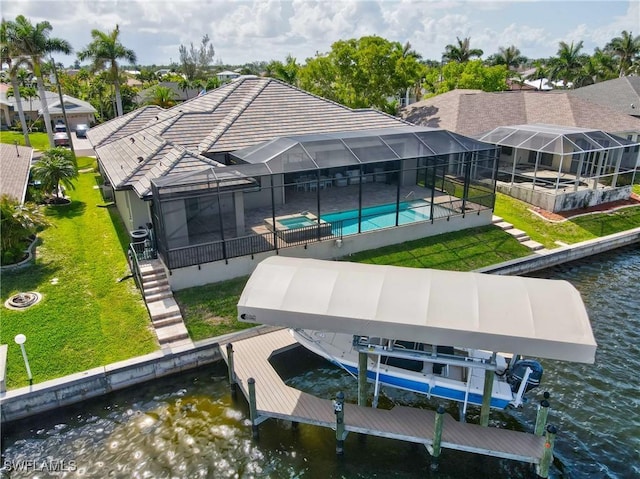 4324 SW 26th Ave, Cape Coral, FL 33914 - dock area with a water view, boat lift, a patio, a pool with connected hot tub, and a yard