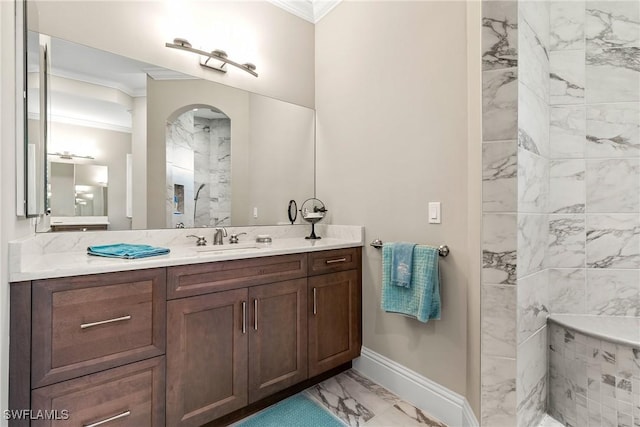 4324 SW 26th Ave, Cape Coral, FL 33914 - bathroom featuring marble look tiles, crown molding, a marble finish shower, vanity, and baseboards