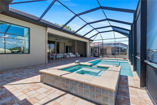 4324 SW 26th Ave, Cape Coral, FL 33914 - view of swimming pool featuring a patio, ceiling fan, a pool with connected hot tub, an outdoor hangout area, and glass enclosure