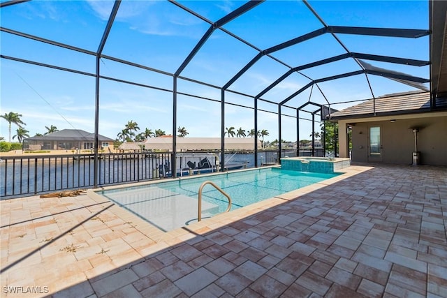4324 SW 26th Ave, Cape Coral, FL 33914 - view of swimming pool with a patio, a pool with connected hot tub, a lanai, and a water view