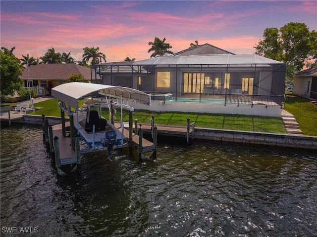 4324 SW 26th Ave, Cape Coral, FL 33914 - dock with a water view, boat lift, glass enclosure, and a yard