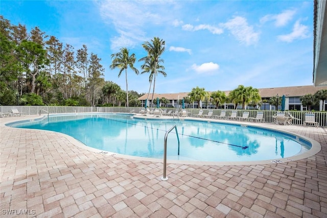 14550 Red Fox Run Unit 407, Naples, FL 34110 - community pool featuring a patio area