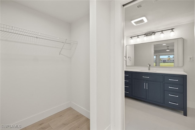 16260 Kelly Cove Dr Unit 235, Fort Myers, FL 33908 - walk in closet featuring light wood finished floors and wet bar