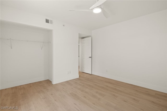 16260 Kelly Cove Dr Unit 235, Fort Myers, FL 33908 - unfurnished bedroom with wood finished floors, a closet, a ceiling fan, and baseboards