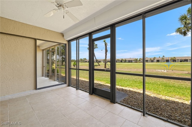 16260 Kelly Cove Dr Unit 235, Fort Myers, FL 33908 - unfurnished sunroom with ceiling fan and a residential view