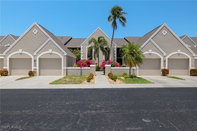 16260 Kelly Cove Dr Unit 235, Fort Myers, FL 33908 - view of front facade featuring driveway and a garage