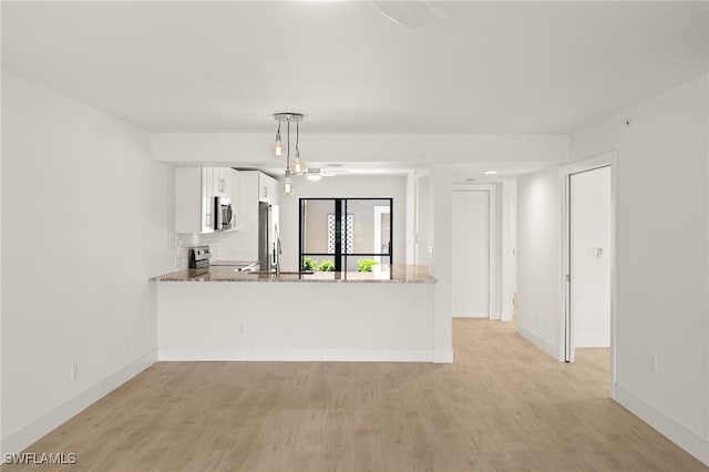 16260 Kelly Cove Dr Unit 235, Fort Myers, FL 33908 - unfurnished living room featuring light wood-style floors and baseboards