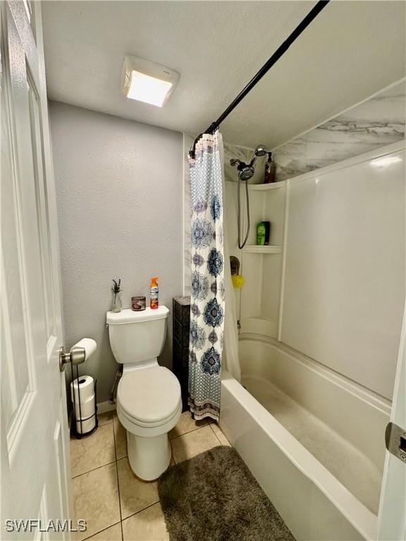 5751 Foxlake Dr Unit A, North Fort Myers, FL 33917 - full bathroom with toilet, tile patterned floors, and shower / bathtub combination with curtain