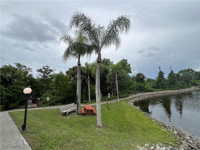 5751 Foxlake Dr Unit A, North Fort Myers, FL 33917 - view of community featuring a water view and a yard