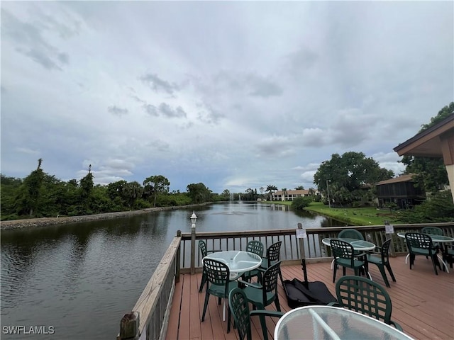5751 Foxlake Dr Unit A, North Fort Myers, FL 33917 - dock area with outdoor dining area and a deck with water view