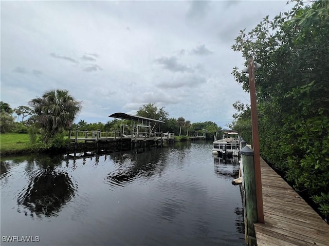 5751 Foxlake Dr Unit A, North Fort Myers, FL 33917 - dock area featuring a water view