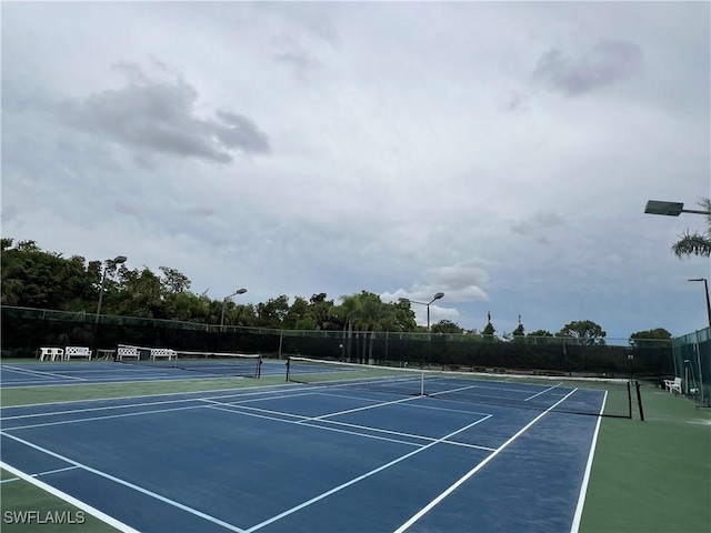 5751 Foxlake Dr Unit A, North Fort Myers, FL 33917 - view of tennis court with community basketball court