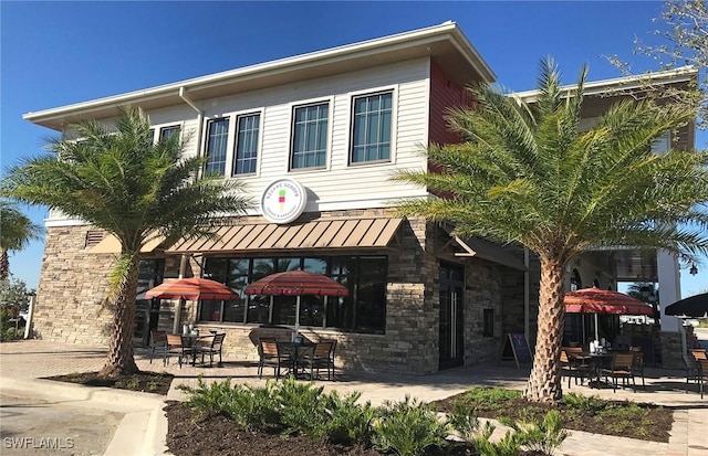 12412 Basalt Ln, Alva, FL 33982 - view of front of property featuring a patio area and stone siding