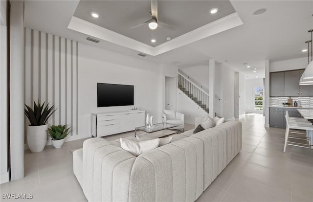 12412 Basalt Ln, Alva, FL 33982 - living area with stairs, recessed lighting, a ceiling fan, light tile patterned floors, and a raised ceiling