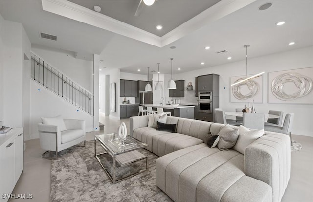 12412 Basalt Ln, Alva, FL 33982 - living area featuring a tray ceiling, recessed lighting, ornamental molding, and stairway