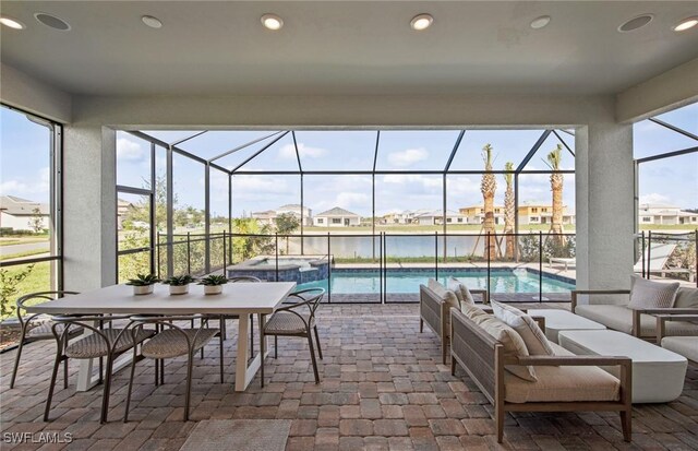 12412 Basalt Ln, Alva, FL 33982 - view of patio featuring an outdoor living space, a lanai, a pool with connected hot tub, and a residential view
