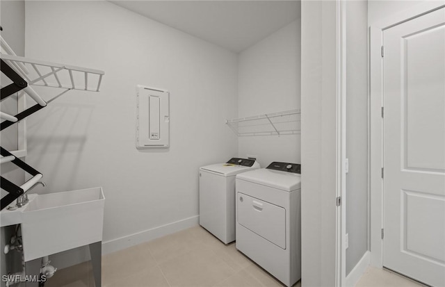 12412 Basalt Ln, Alva, FL 33982 - washroom featuring washing machine and dryer, baseboards, and electric panel