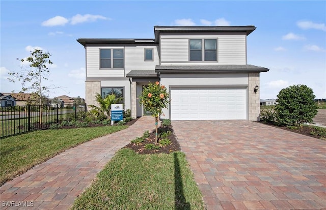 12412 Basalt Ln, Alva, FL 33982 - view of front of house featuring an attached garage and decorative driveway