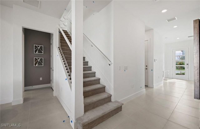 12412 Basalt Ln, Alva, FL 33982 - stairs with tile patterned flooring, baseboards, and recessed lighting