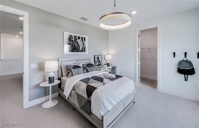 12412 Basalt Ln, Alva, FL 33982 - carpeted bedroom with a walk in closet, baseboards, and recessed lighting