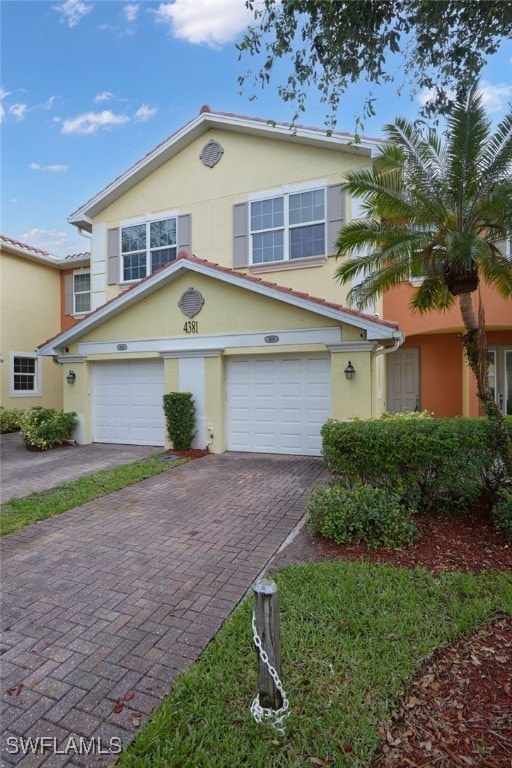 4381 Lazio Way Unit 504, Fort Myers, FL 33901 - multi unit property featuring stucco siding and decorative driveway