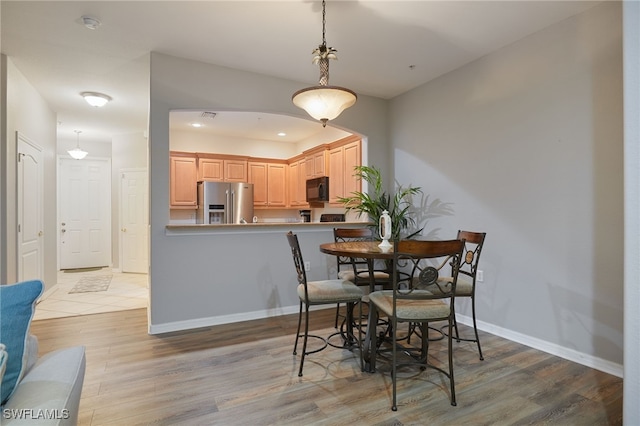 4381 Lazio Way Unit 504, Fort Myers, FL 33901 - dining room featuring light wood-style floors and baseboards