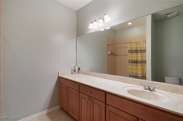 4381 Lazio Way Unit 504, Fort Myers, FL 33901 - bathroom featuring toilet, tile patterned flooring, vanity, baseboards, and a shower with shower curtain