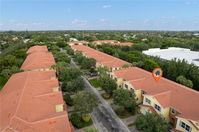 4381 Lazio Way Unit 504, Fort Myers, FL 33901 - aerial perspective of suburban area featuring a tree filled landscape