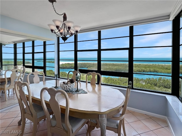 440 Seaview Ct Unit 1012, Marco Island, FL 34145 - dining space with a water view, light tile patterned floors, a chandelier, and baseboards