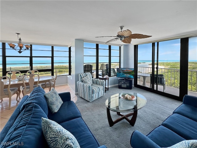 440 Seaview Ct Unit 1012, Marco Island, FL 34145 - living area featuring a wall of windows, ceiling fan, and a chandelier