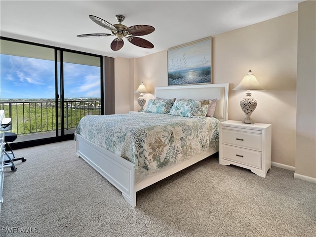 440 Seaview Ct Unit 1012, Marco Island, FL 34145 - bedroom featuring light colored carpet, access to outside, a wall of windows, ceiling fan, and baseboards