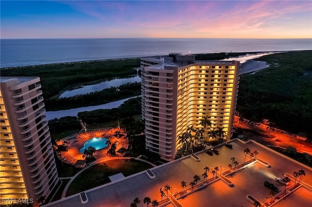 440 Seaview Ct Unit 1012, Marco Island, FL 34145 - aerial view at dusk of a water view and view of pool area