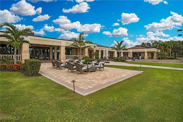 96 Silver Oaks Cir Unit 1-202, Naples, FL 34119 - back of property with a yard and stucco siding