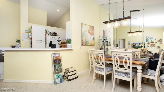 96 Silver Oaks Cir Unit 1-202, Naples, FL 34119 - dining room featuring high vaulted ceiling and carpet floors