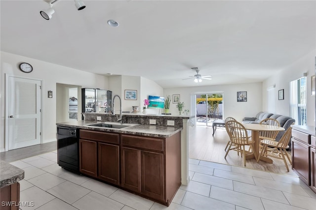 4326 SW 9th Ave, Cape Coral, FL 33914 - kitchen featuring black dishwasher, a sink, open floor plan, and light tile patterned floors