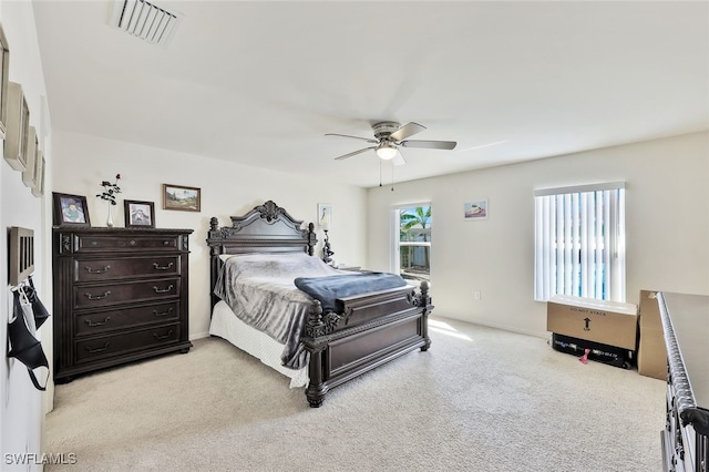 4326 SW 9th Ave, Cape Coral, FL 33914 - bedroom with light carpet, ceiling fan, and baseboards