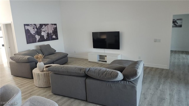 702 NW 30th Pl, Cape Coral, FL 33993 - living area featuring wood finished floors and baseboards
