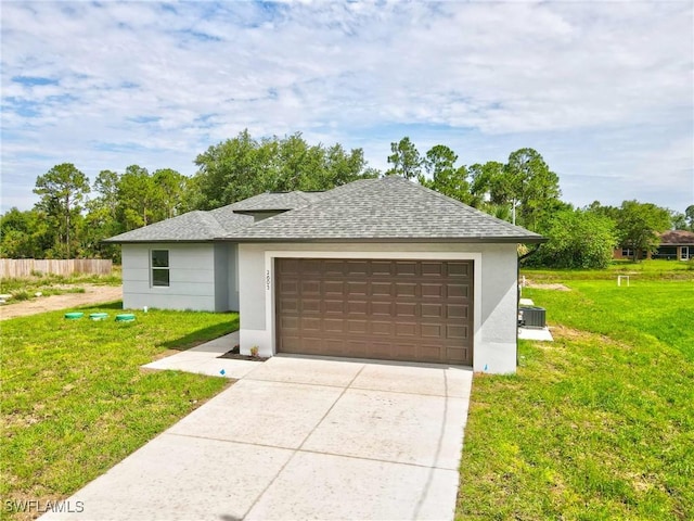 2605 Darlene Pl, Lehigh Acres, FL 33971 - garage featuring concrete driveway
