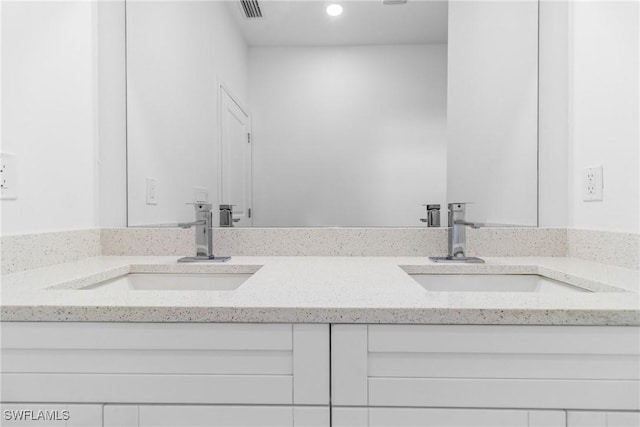 2605 Darlene Pl, Lehigh Acres, FL 33971 - bathroom with double vanity and recessed lighting