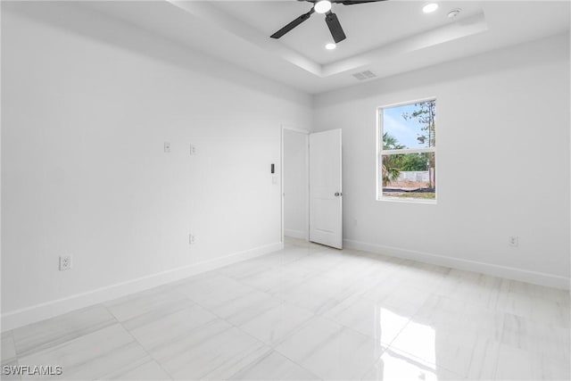 2605 Darlene Pl, Lehigh Acres, FL 33971 - unfurnished room with baseboards, a tray ceiling, recessed lighting, a ceiling fan, and a smoke detector