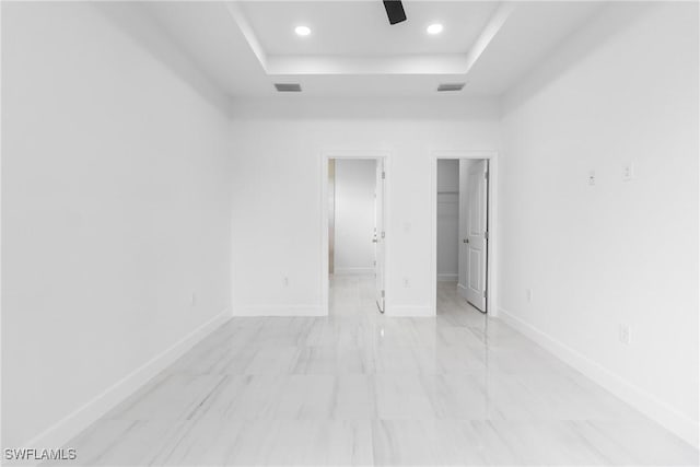 2605 Darlene Pl, Lehigh Acres, FL 33971 - unfurnished bedroom with a raised ceiling, a spacious closet, recessed lighting, baseboards, and a ceiling fan