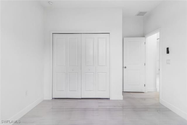 2605 Darlene Pl, Lehigh Acres, FL 33971 - unfurnished bedroom featuring baseboards and a closet