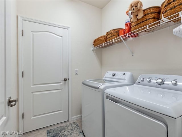 11992 Arbor Trace Dr, Fort Myers, FL 33913 - laundry area with washer and dryer and light tile patterned floors